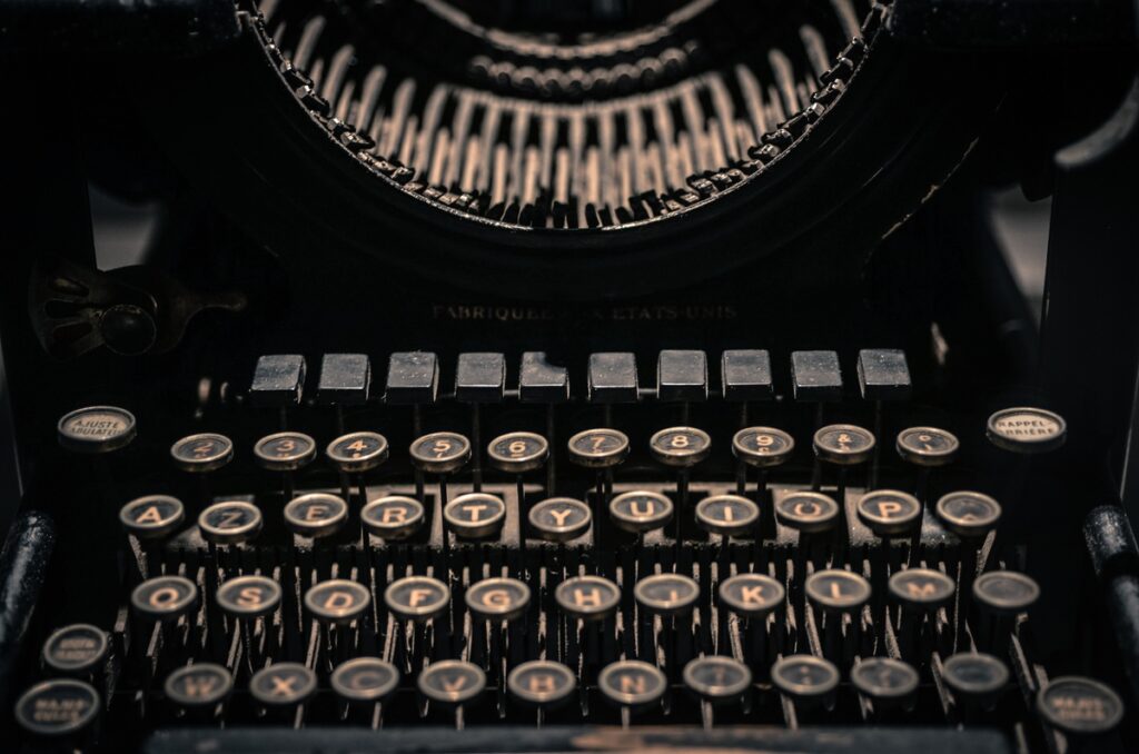A black old-fashioned typewriter